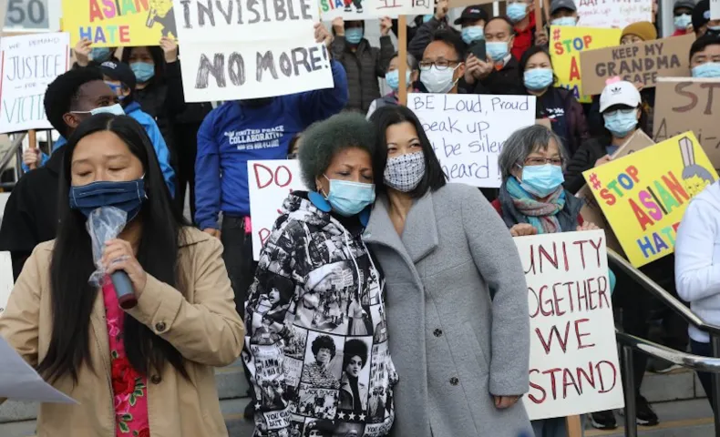 Mattie Scott (center, left to right), founder and Executive Director of Healing 4 Our Families & Our Nation and Nancy Tung, public safety advocate, hold each other as they rally with demonstrators rallying in front of the Hall of Justice as they demand justice for Vicha Ratanapakdee on March 22 in San Francisco Lea Suzuki—The San Francisco Chronicle/Getty Images