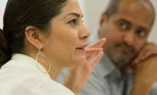 Woman shares her thoughts in a meeting