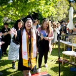 A college graduate heading to the stage for her diploma