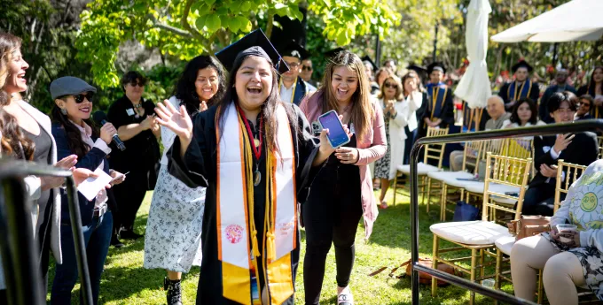 A college graduate heading to the stage for her diploma