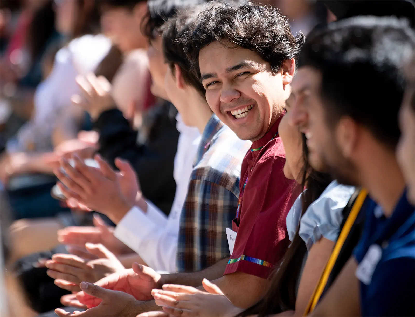 College students clapping at graduation